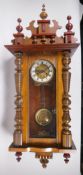 A mahogany cased Vienna wall clock, the movement striking on a gong, 37 x 96cm