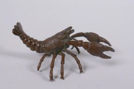 A Japanese style bronze okimono crayfish, impressed mark to base, 10cm long