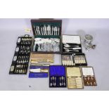 A canteen and four boxes of silver plated Butler's Bead pattern flatware, and a large collection