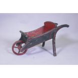 A vintage painted pine child's wheel barrow, 72cm long, 36cm high