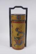 A Chinese gilt lacquered cylinder container with chased and painted dragon decoration, the cover