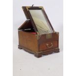 An oriental elm vanity box, with brass mounts, single drawer and lift and fold over top fitted