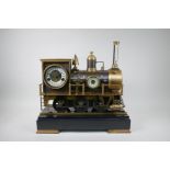 A French style bronze and brass automaton locomotive clock, 47cm long, 45cm high