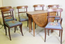 A George III mahogany drop leaf table and a set of six mahogany dining chairs with bar backs and
