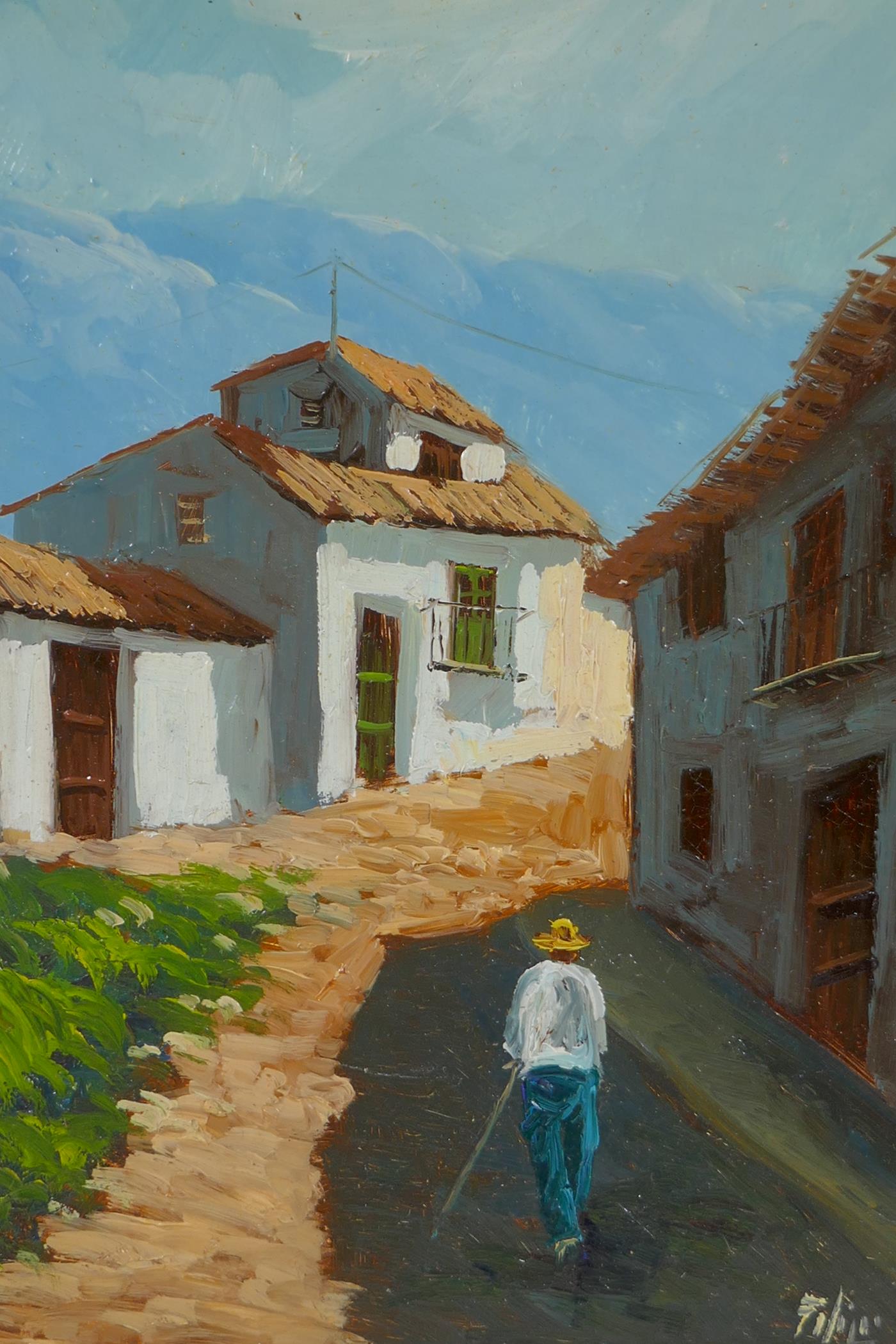 Continental village street with distant mountains, indistinctly signed, oil on board, 24 x 30cm