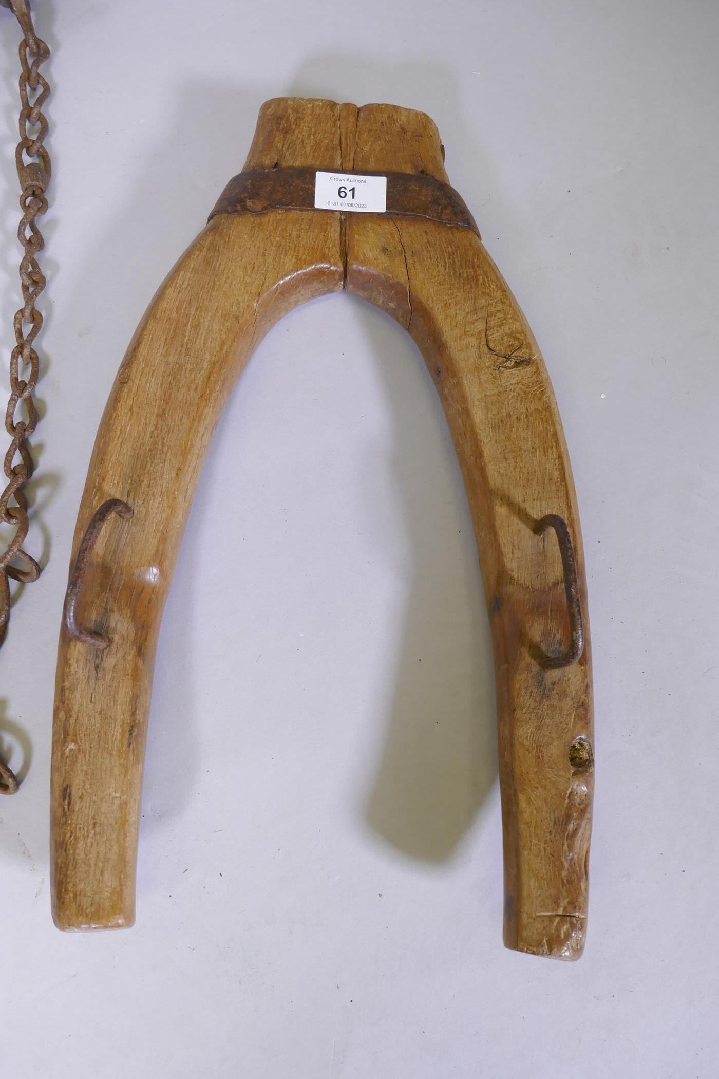 A C19th painted wood yoke, 88cm long and a donkey's collar - Image 2 of 3