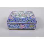 A Chinese enamel box with famille rose floral decoration on a blue ground, 10 x 8cm