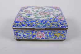 A Chinese enamel box with famille rose floral decoration on a blue ground, 10 x 8cm