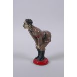 A cold painted metal figural pin cushion, 12cm high