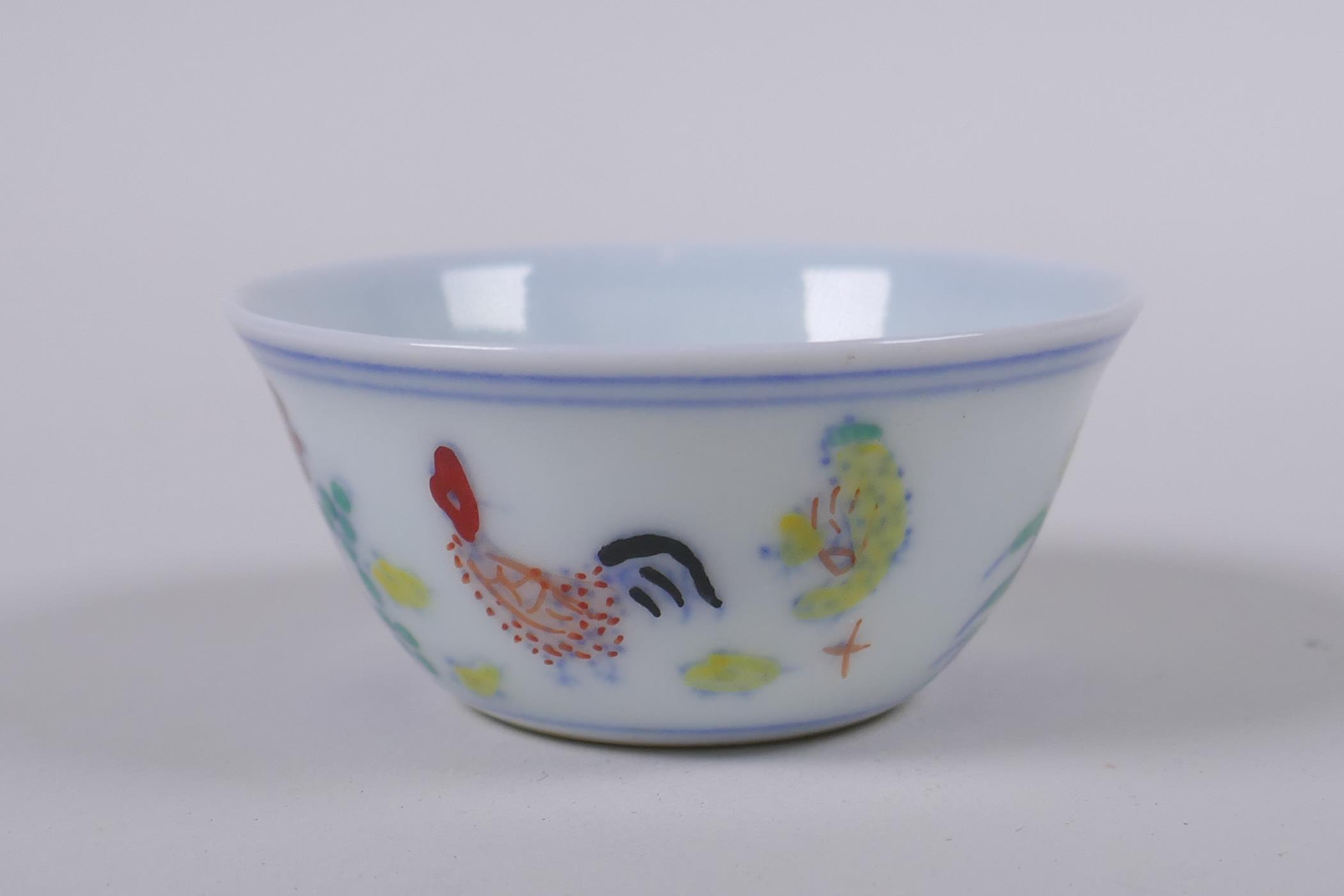 A Doucai porcelain tea bowl with chicken decoration, Chinese Chenghua 6 character mark to base,