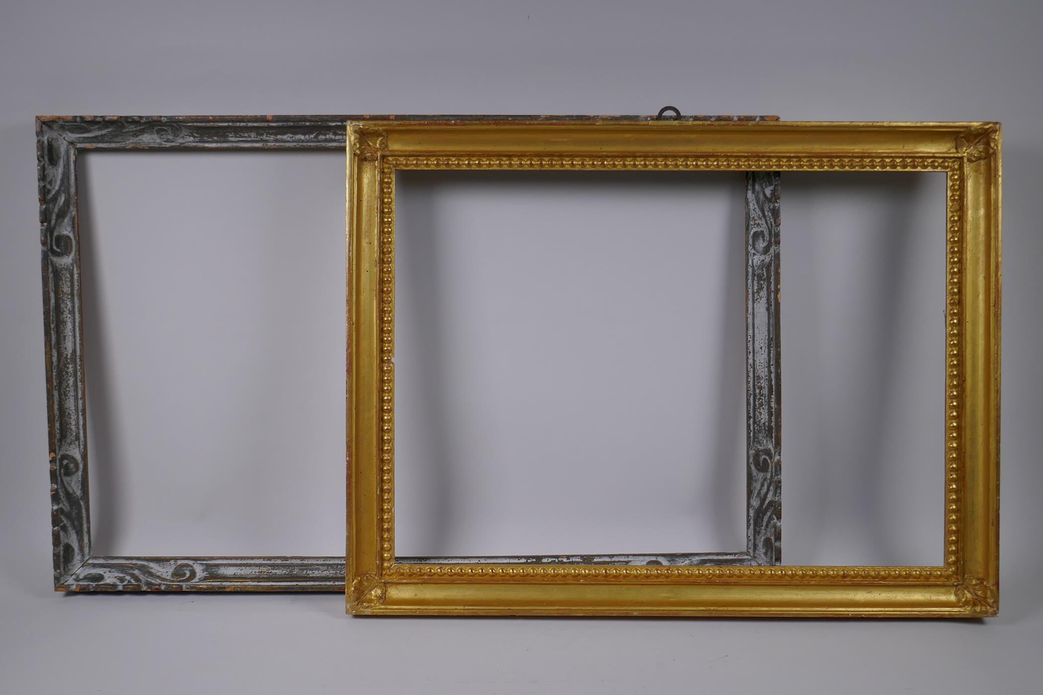 A giltwood picture frame, with bead and corner leaf decoration, and an early C20th carved wood