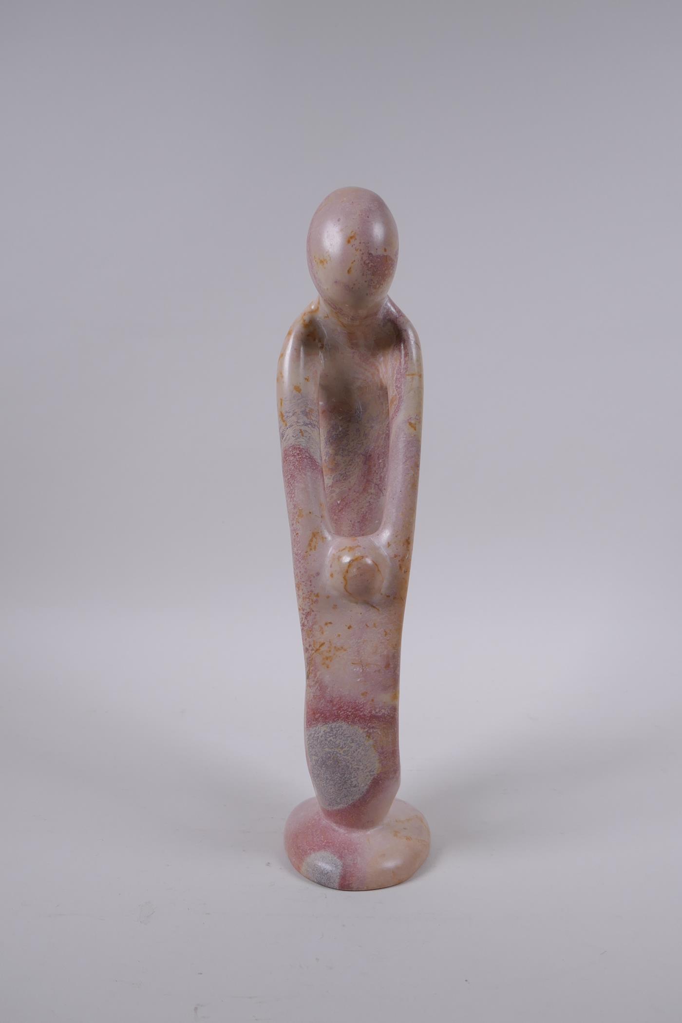 A Kenyan carved and polished Kisii stone figure group in the form of a mother and child, 23cm high - Image 2 of 5