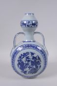 A Chinese blue and white porcelain two handled garlic head shaped flask with phoenix decoration,