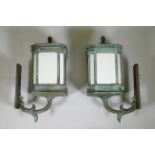 A large pair of early C20th bronze wall lanterns, well patinated and wired for electricity, 75cm