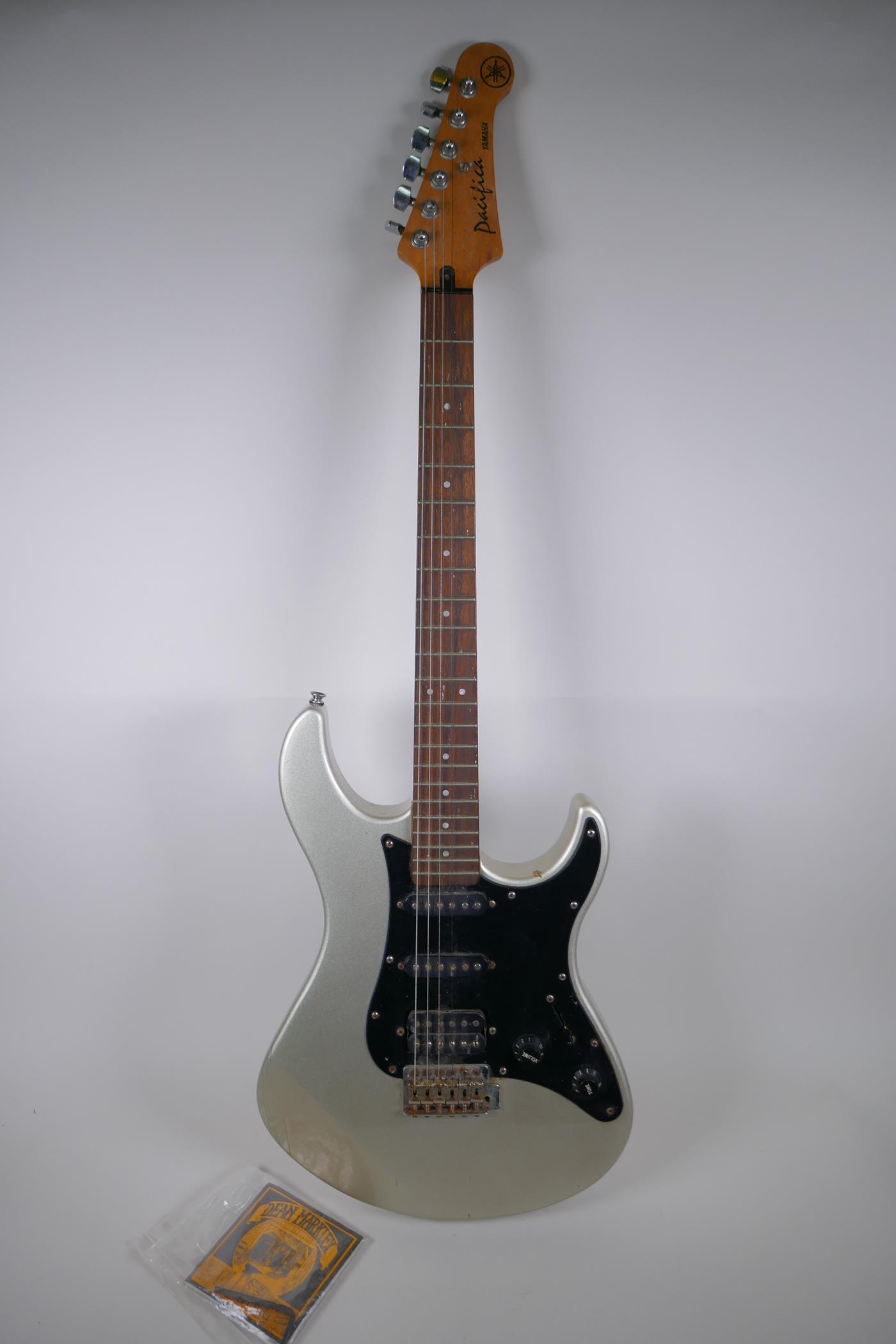 A silver Yamaha Pacifica 112X electric guitar, 98cm long