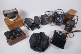 Three vintage medium format film cameras including two Voigtlander Brilliant Compur and Lubitel 2, a