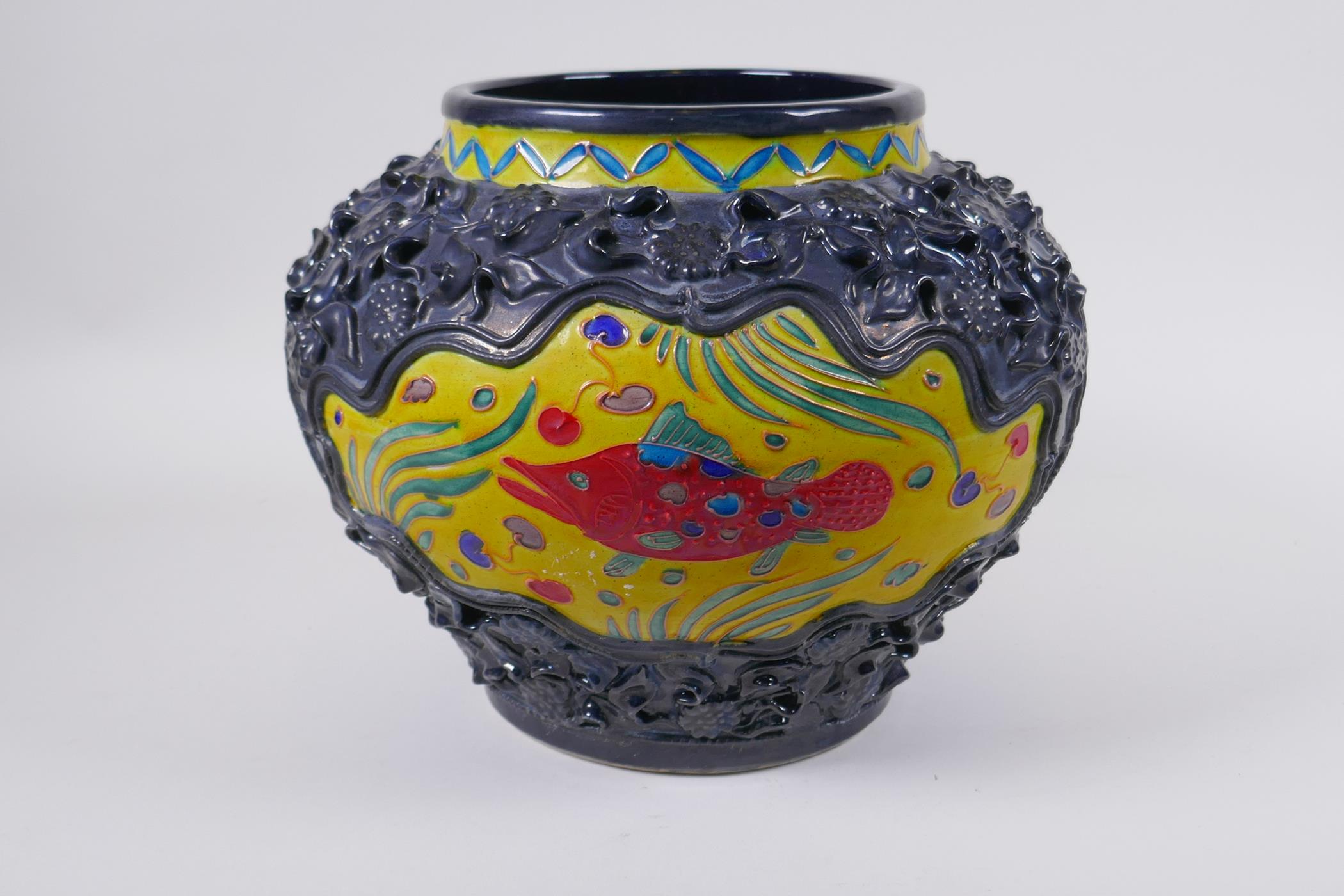 A Chinese Fahua pottery jar with decorative panels depicting carp, the raised surround decorated - Image 2 of 4