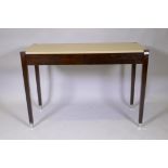 A contemporary hardwood two drawer writing table with faux shagreen top, 100 x 50 x 75cm