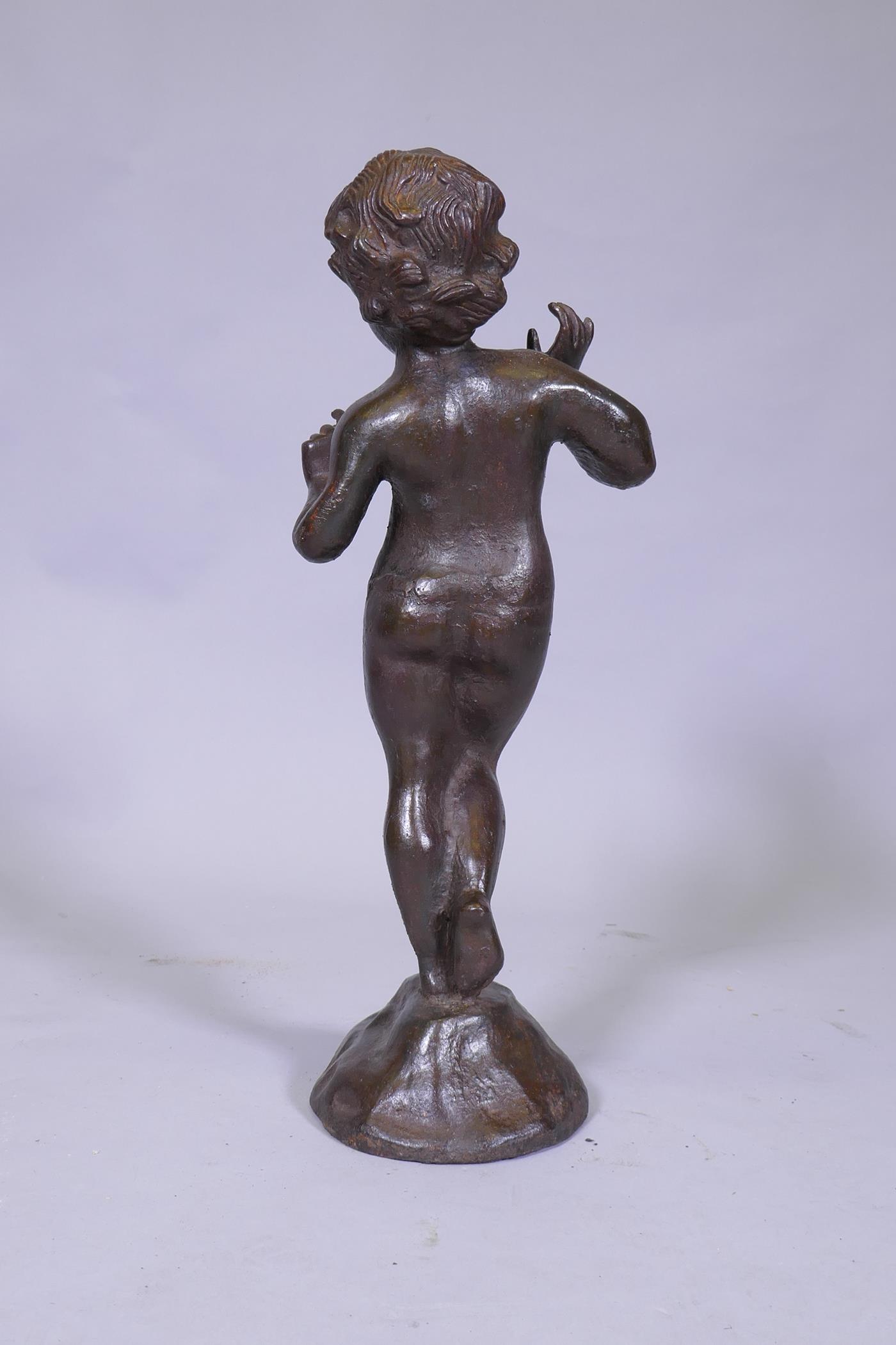 A cast iron figure of a putto, 53cm high - Image 3 of 3