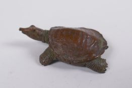A Japanese style bronze okimono tortoise, impressed mark to base, 5cm long