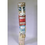 A carved and painted wood totem pole, 155cm high