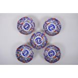 A set of five Japanese Imari porcelain bowls of lobed form, 14cm diameter