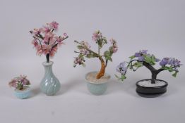 Four Chinese hardstone and coloured glass trees, largest 23cm high
