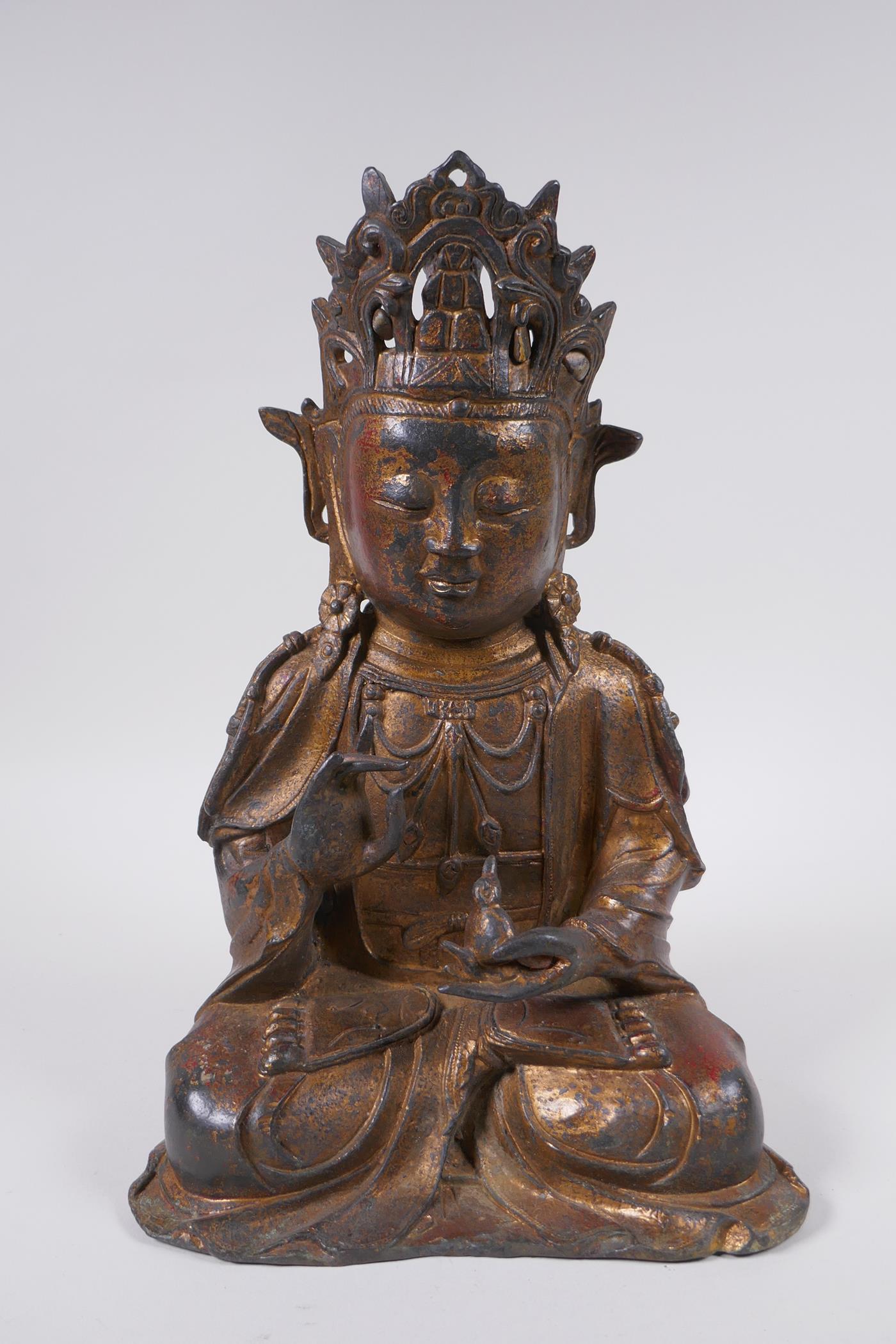 A Sino Tibetan gilt bronze figure of Buddha, 31cm high