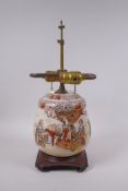 A Japanese Satsuma pottery jar and cover, decorated with an emperor and attendants, converted to a