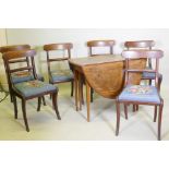 A George III mahogany drop leaf table and a set of six mahogany dining chairs with bar backs and