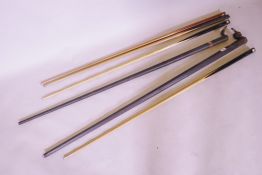An F.J. Riley 16½oz snooker cue, a Thurston Special Royal 16½oz cue in metal case, and two other
