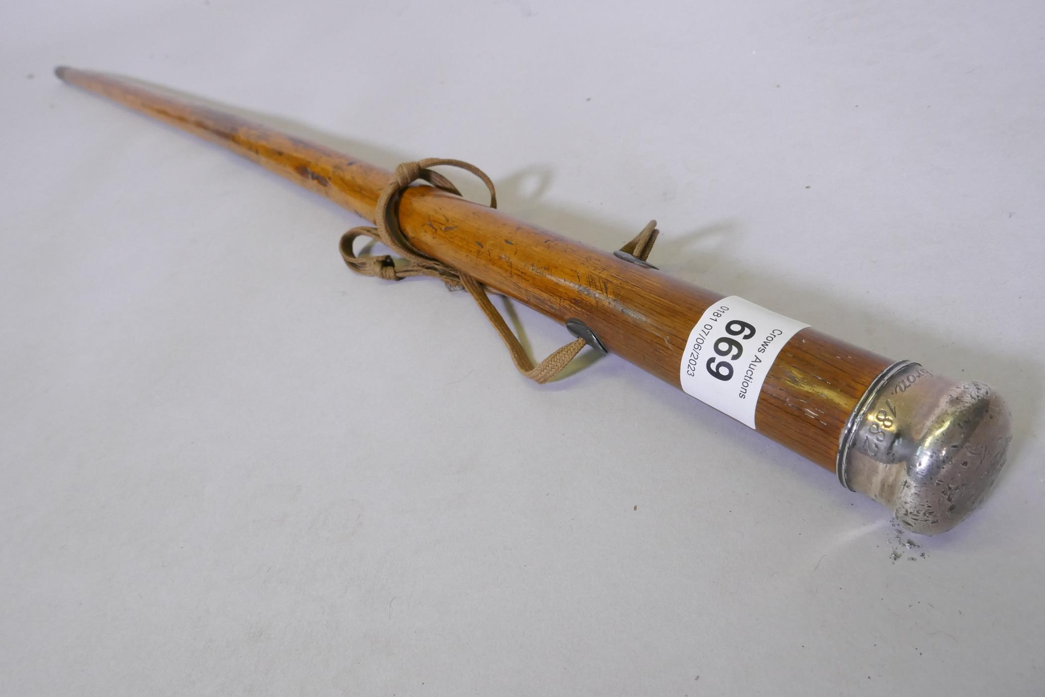 An antique walking stick with white metal top inscribed Oak from Hebron 1882, 91cm long