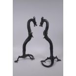 A pair of Chinese bronze dragons, 40cm high