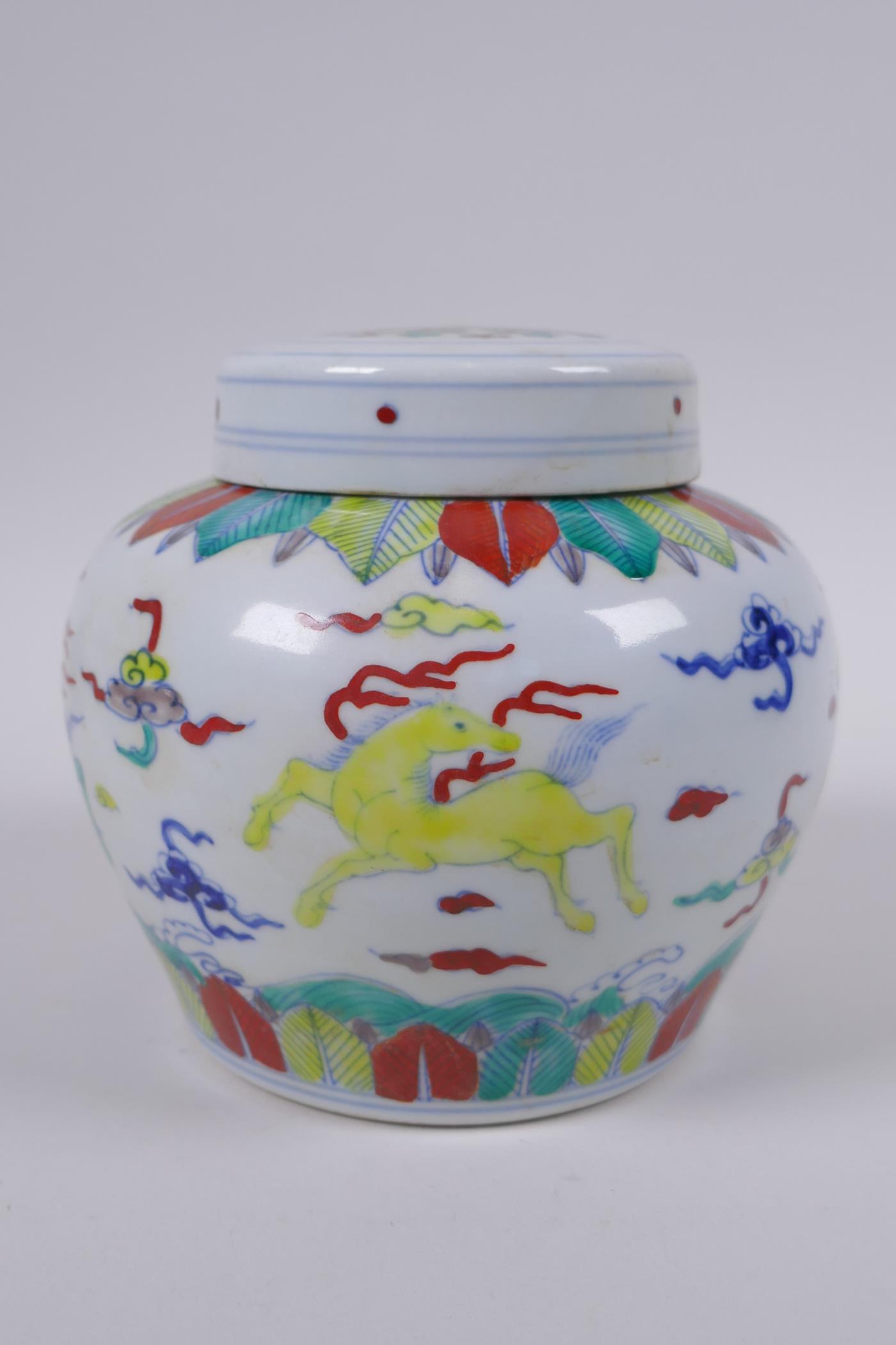 A Chinese Doucai porcelain ginger jar and cover, decorated with mythical creatures, mark to base,