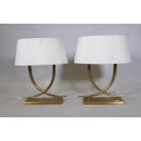 A pair of R.V. Astley 'Iva' table lamps in antiqued brass finish, 59cm high with shade