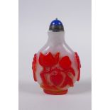 A Chinese Peking glass snuff bottle with raised peach, bat and mythical creature decoration, 7 cm