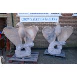 A pair of monumental carved marble eagles, 152cm high