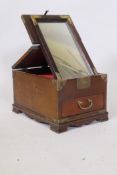 An oriental elm vanity box, with brass mounts, single drawer and lift and fold over top fitted