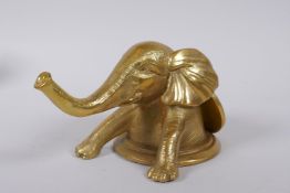 A Chinese gilt bronze elephant and pi disc ornament, 9cm high