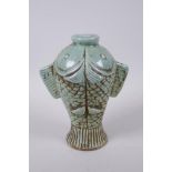 A Chinese celadon glazed porcelain carp vase, 22cm high