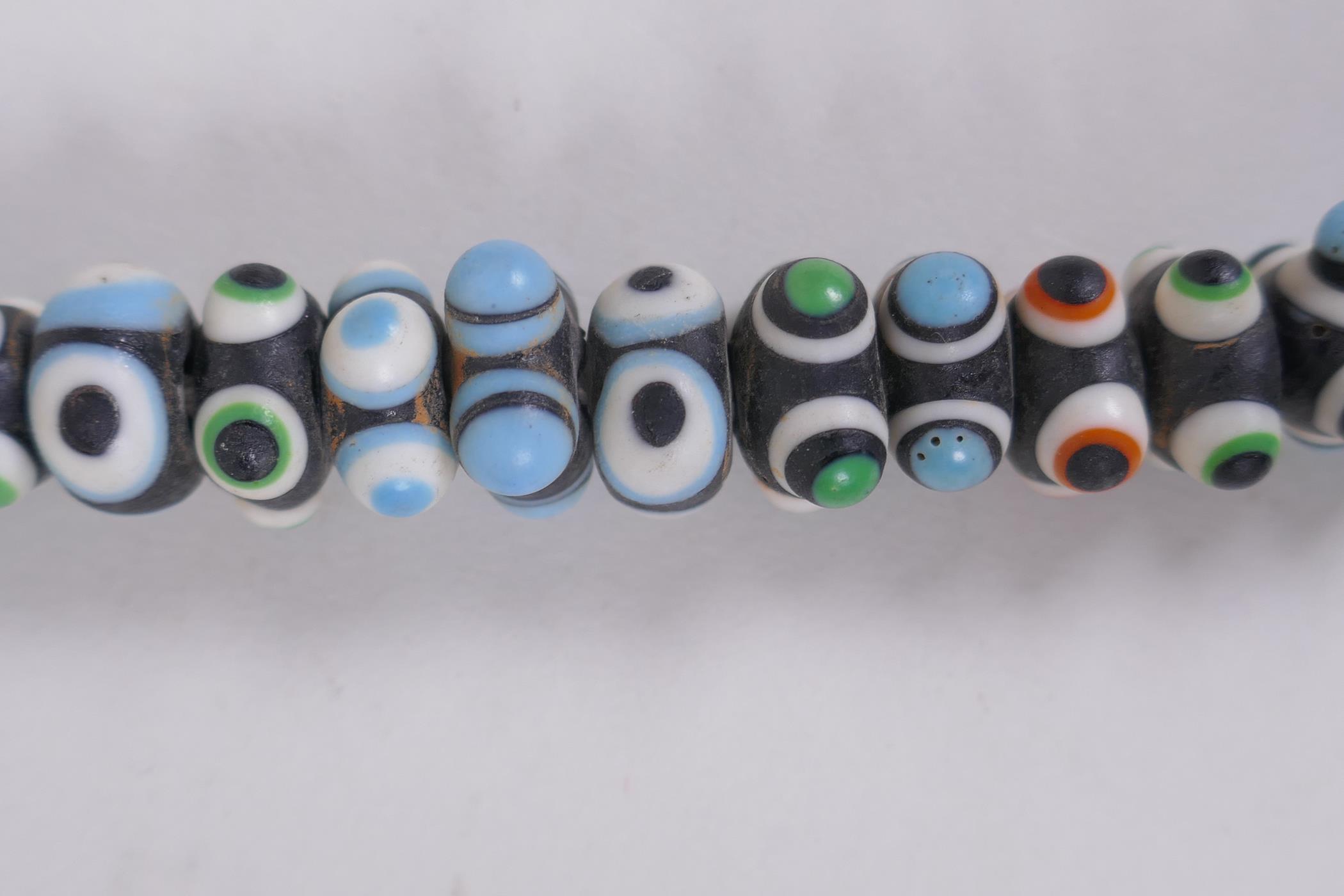 A Venetian glass eye bead necklace, 64cm long - Image 4 of 5