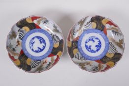 A pair of Japanese Imari porcelain bowls with scalloped rims, 15cm diameter