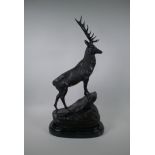 After Jules Moigniez, (French 1835-1894), a bronze stag, standing on a rocky outcrop, 72cm high