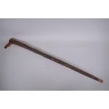 An antique gnarled wood walking stick, 93cm long