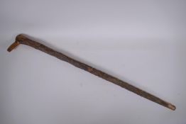 An antique gnarled wood walking stick, 93cm long