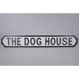 A painted wood sign, 'The Dog House', in the style of a road sign, 88 x 14cm