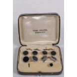 A cased set of black enamel and white metal cufflinks and studs, 1 stud missing