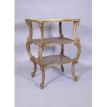 A C19th Italian giltwood three tier serpentine shaped etagere, with inset marble top and caned