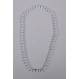 A white hardstone bead necklace, 68cm long