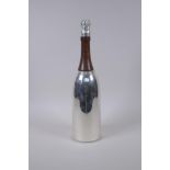 A silver plated cocktail shaker in the form of a champagne bottle, 37cm high